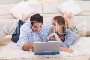 Happy couple surfing on the internet
