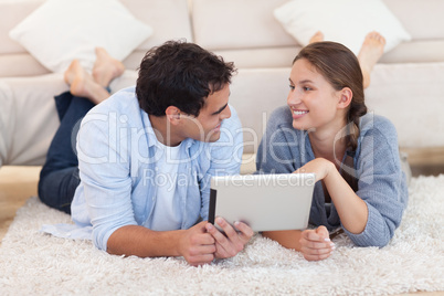 Cute couple using a tablet computer