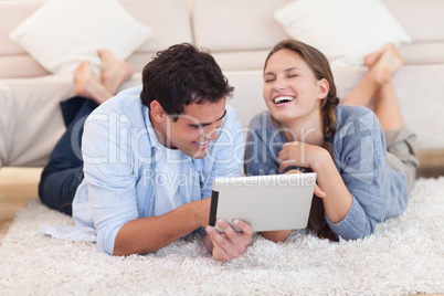 Beautiful couple using a tablet computer