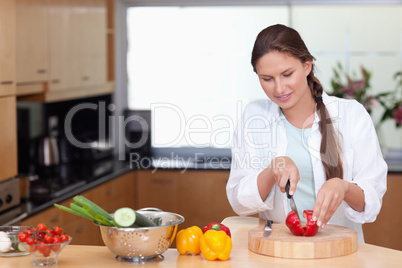 Woman slicing a pepper