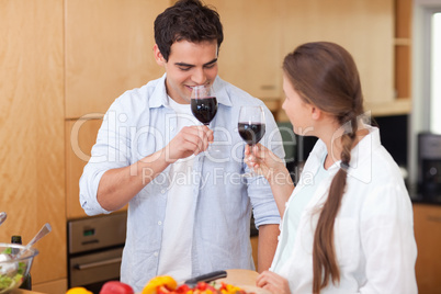 Couple drinking a glass of red wine
