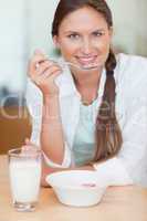 Portrait of a cute woman having breakfast