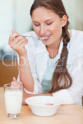 Portrait of a calm woman having breakfast