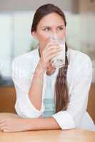 Portrait of a radiant woman drinking milk