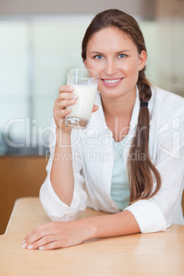 Portrait of a glowing woman drinking milk