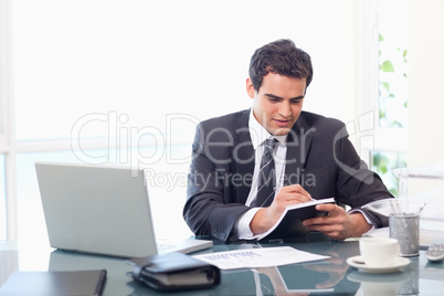 Businessman taking notes