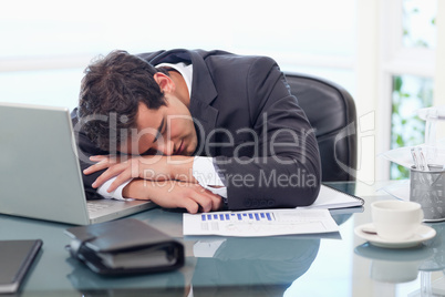 Tired businessman sleeping