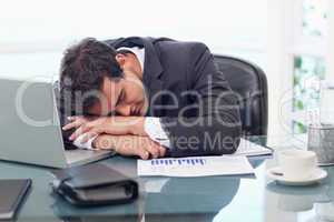 Tired businessman sleeping