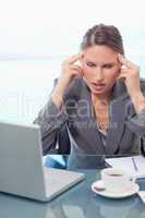 Portrait of a businesswoman having a headache