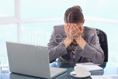 Frustrated businesswoman crying