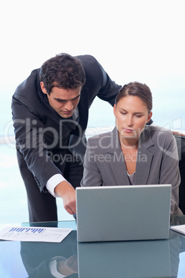 Portrait of a business team working with a notebook