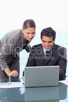 Portrait of a young business team working with a notebook