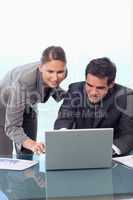 Portrait of a young business team working with a laptop