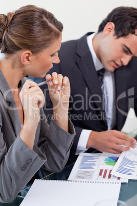 Portrait of a focused business team studying statistics