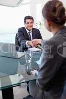 Portrait of a manager interviewing a female applicant