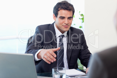 Businessman giving his hand