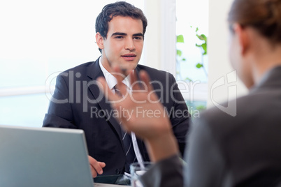 Handsome manager interviewing a female applicant