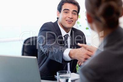 Smiling manager interviewing a female applicant