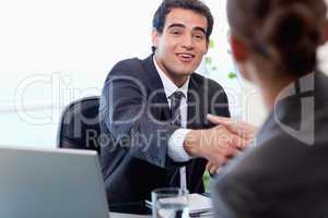 Smiling manager interviewing a female applicant