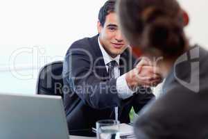 Satisfied manager interviewing a female applicant