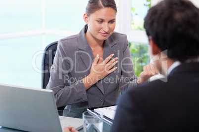 Businesswoman talking to customer