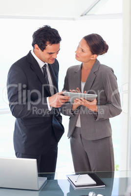 Business partner working on tablet together