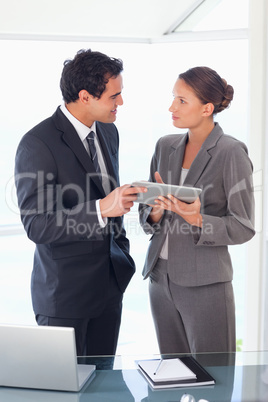 Business partner standing with tablet in their hands