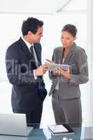 Business partner looking at tablet in their hands