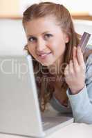 Close up of female online shopper on her sofa