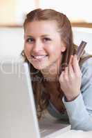 Close up of smiling female booking a flight online