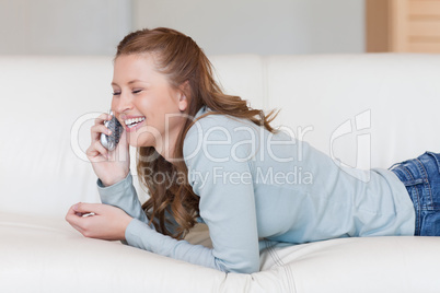 Young woman laughing on the phone