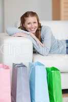 Woman taking a rest on the sofa after shopping tour