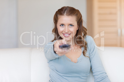 Young female using remote