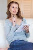 Woman thinking about her notes