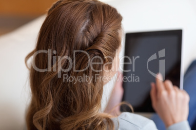Above view of woman typing on her tablet