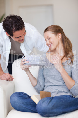 Woman happy about the gift she just got from her boyfriend