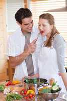 Couple enjoys being in the kitchen together