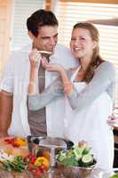 Couple enjoys preparing dinner together