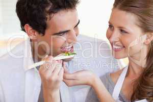 Smiling couple enjoys cooking together