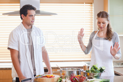 Couple having a disagreement in the kitchen
