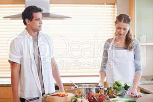 Couple having a tensed situation in the kitchen