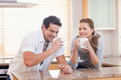 Couple having tea in the kitchen