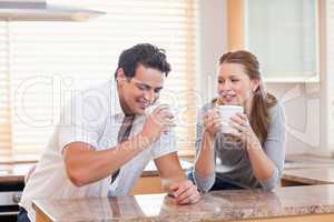 Couple having tea in the kitchen