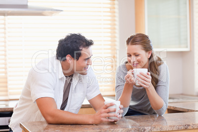 Couple enjoying tea in the kitchen