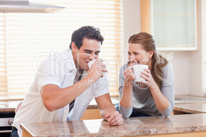 Couple drinking tea in the kitchen