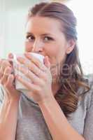 Close up of woman enjoying coffee