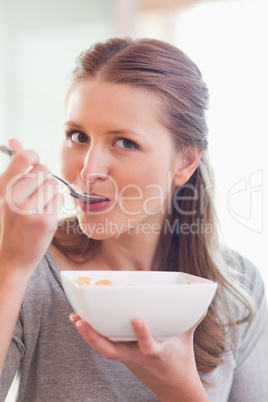 Close up of female having cereals for breakfast