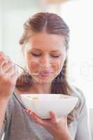 Close up of female eating cereals