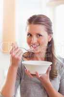 Woman having some cereals for breakfast