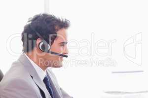 Side view of businessman with headset on